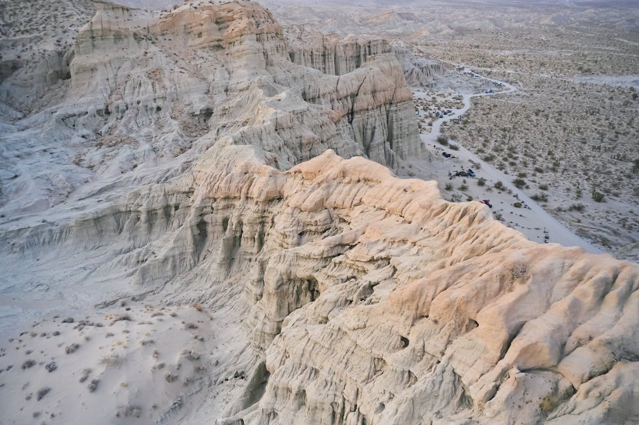Drone shot of rugged rock formations in Cantil, CA, showcasing geological beauty from above.